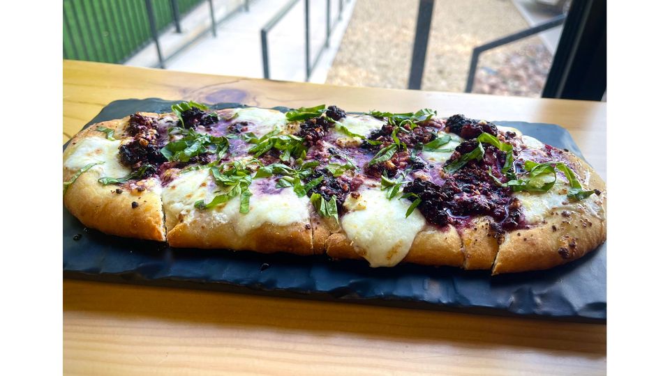 A visualization of the menu item "Blackberry Basil Flatbread"