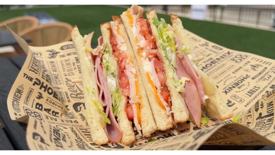 A visualization of the menu item "Phoenix Club Sandwich"