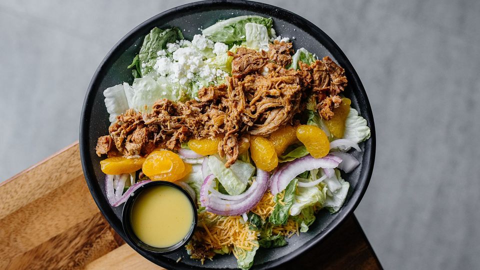 A visualization of the menu item "Orange Citrus Pulled Pork Salad"