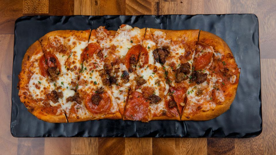 A visualization of the menu item "Meat Lover's Flatbread"