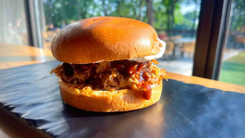 A visualization of the menu item "BBQ Pulled Pork Sandwich"