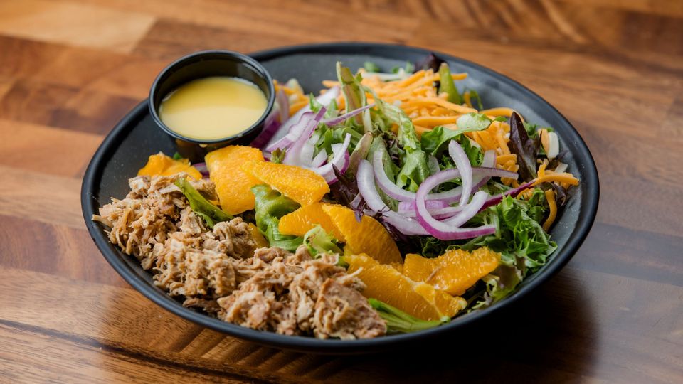 A visualization of the menu item "Orange Citrus Pulled Pork Salad"